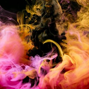 Colorful swirling inks blending in water, creating an abstract visual masterpiece.